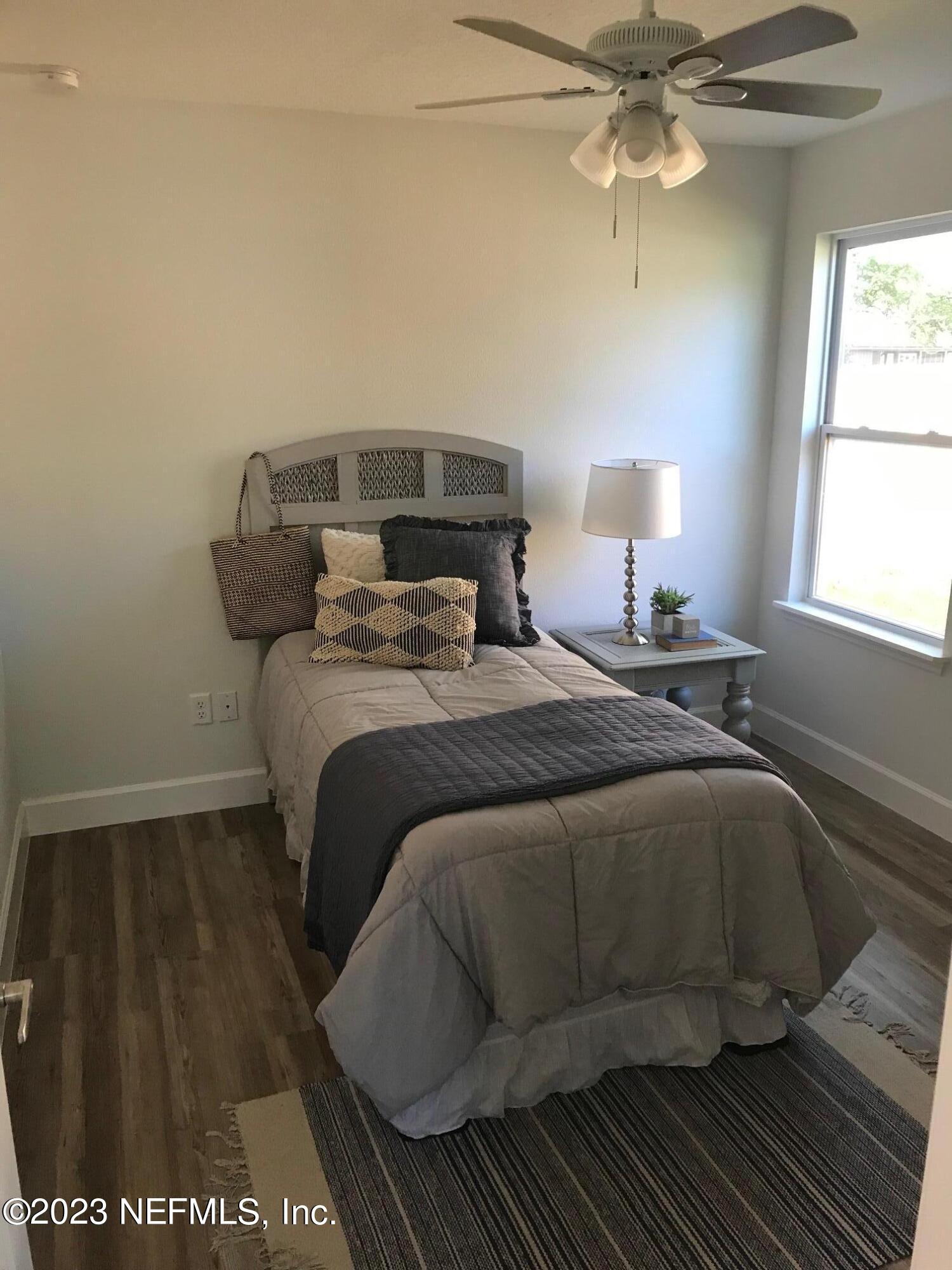 3748 Foxcroft Road Jacksonville, FL 32257 - Photo 25 of 33 a bedroom with a bed and window