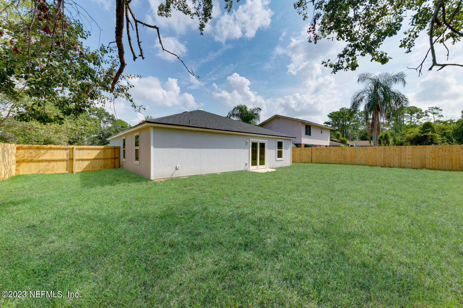 3748 Foxcroft Road Jacksonville, FL 32257 - Photo 32 of 33 a backyard of a house with lots of green space