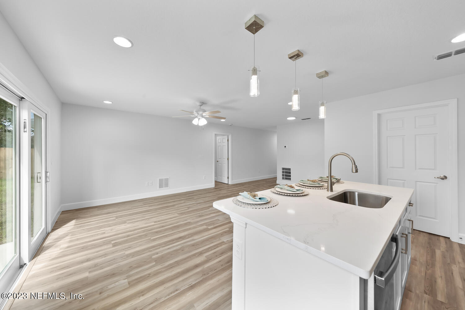 3748 Foxcroft Road Jacksonville, FL 32257 - Photo 7 of 33 a kitchen with stainless steel appliances granite countertop a sink a stove and a refrigerator with wooden floor