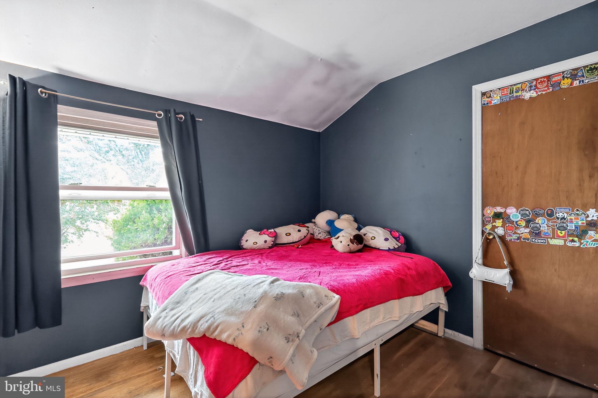 2924 Gracefield Road Silver Spring, MD 20904 - Photo 13 of 29 a bedroom with a bed and wooden floor