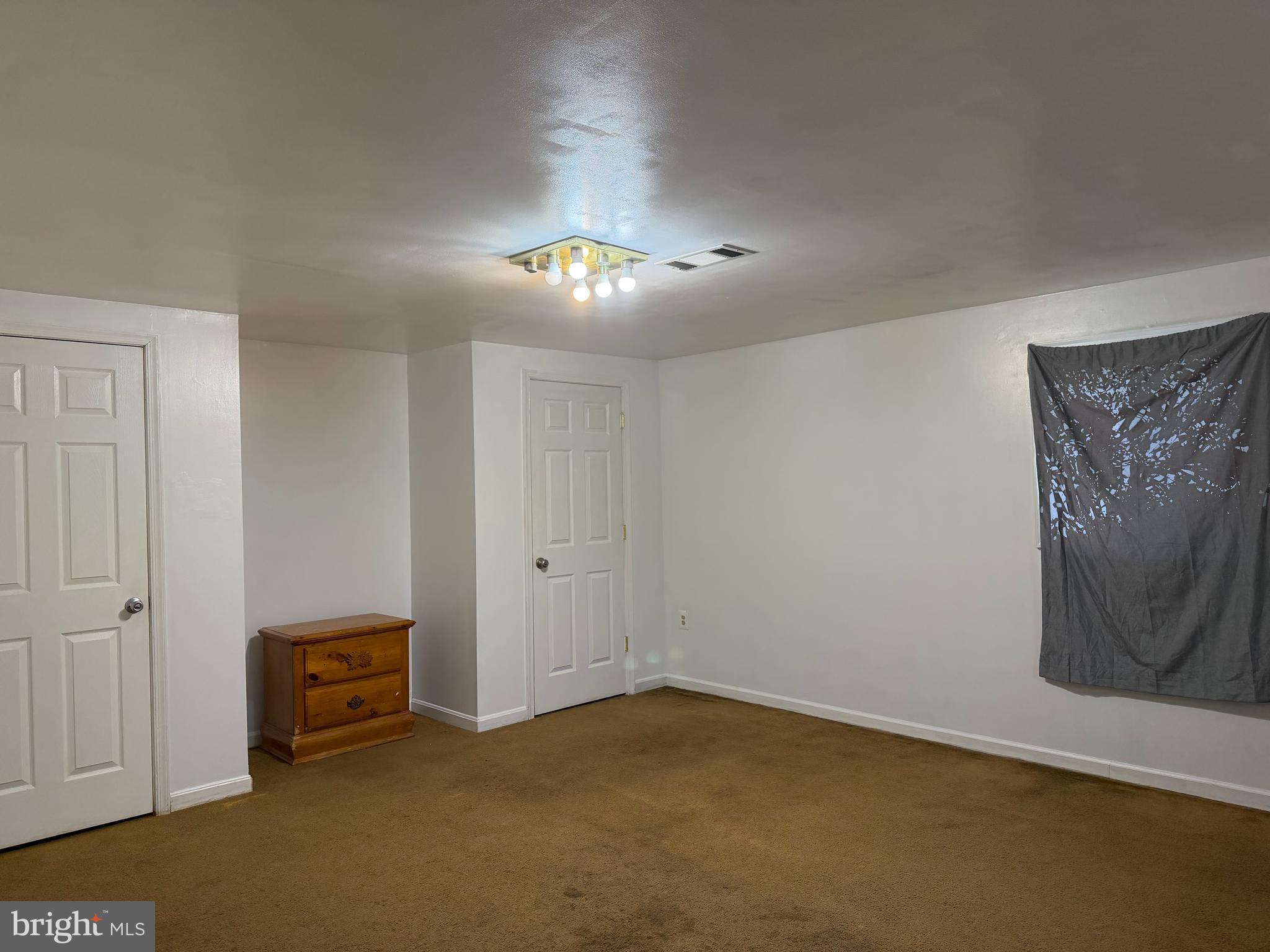 2924 Gracefield Road Silver Spring, MD 20904 - Photo 18 of 29 an empty room with a mirror