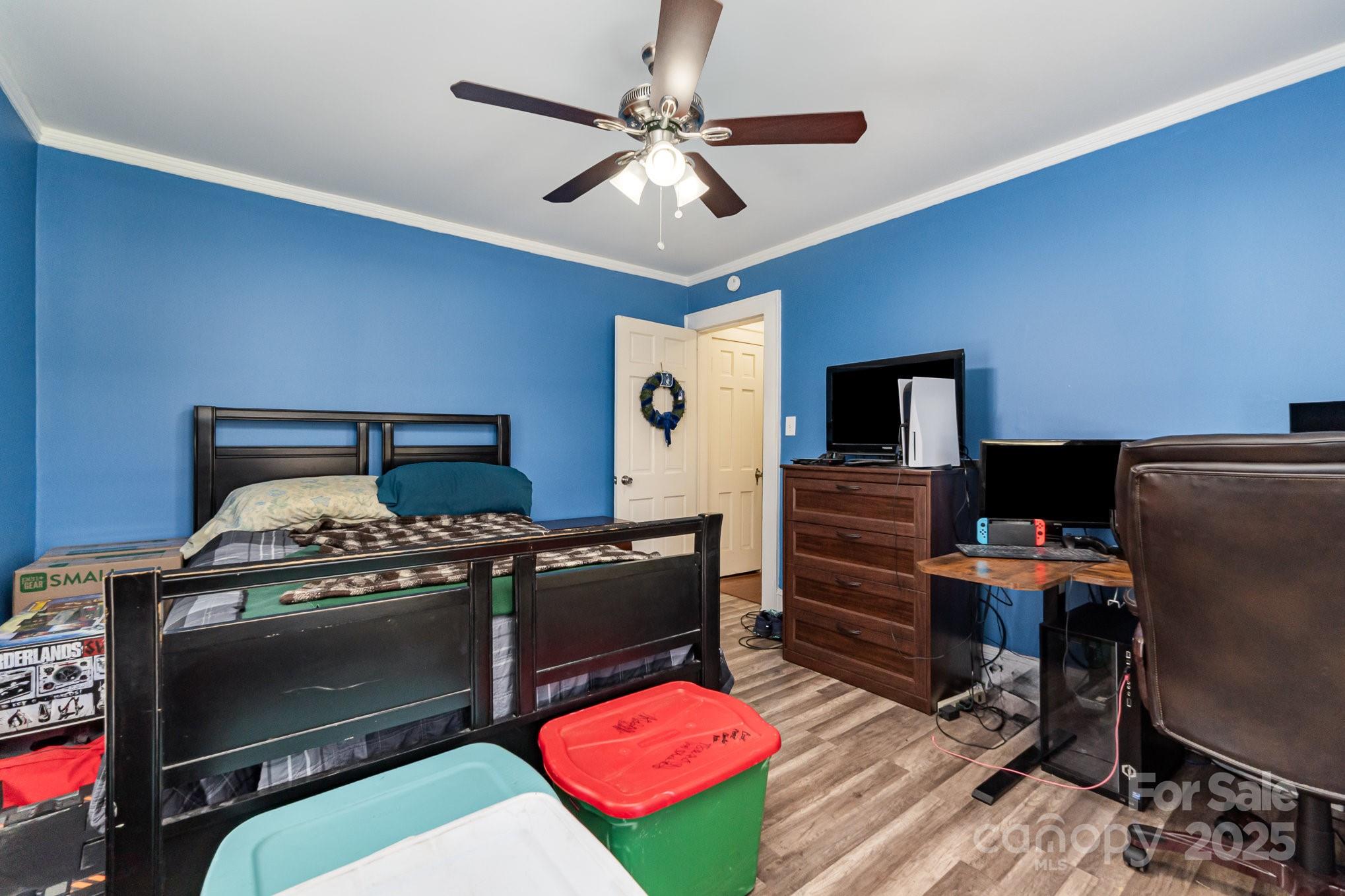 1306 Brantley Road Kannapolis, NC 28083 - Photo 15 of 29 a bedroom with furniture and a flat screen tv