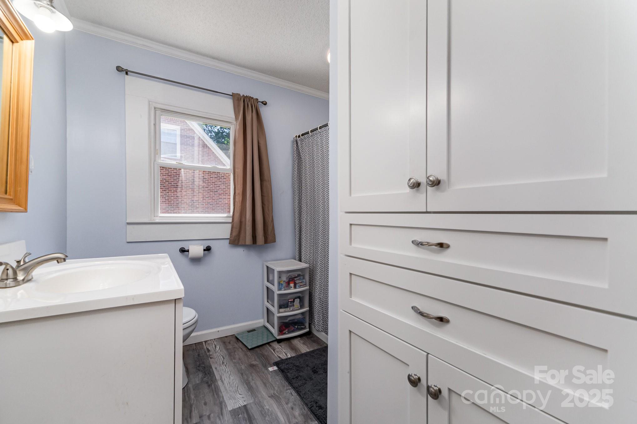 1306 Brantley Road Kannapolis, NC 28083 - Photo 16 of 29 a bathroom with a sink and a mirror