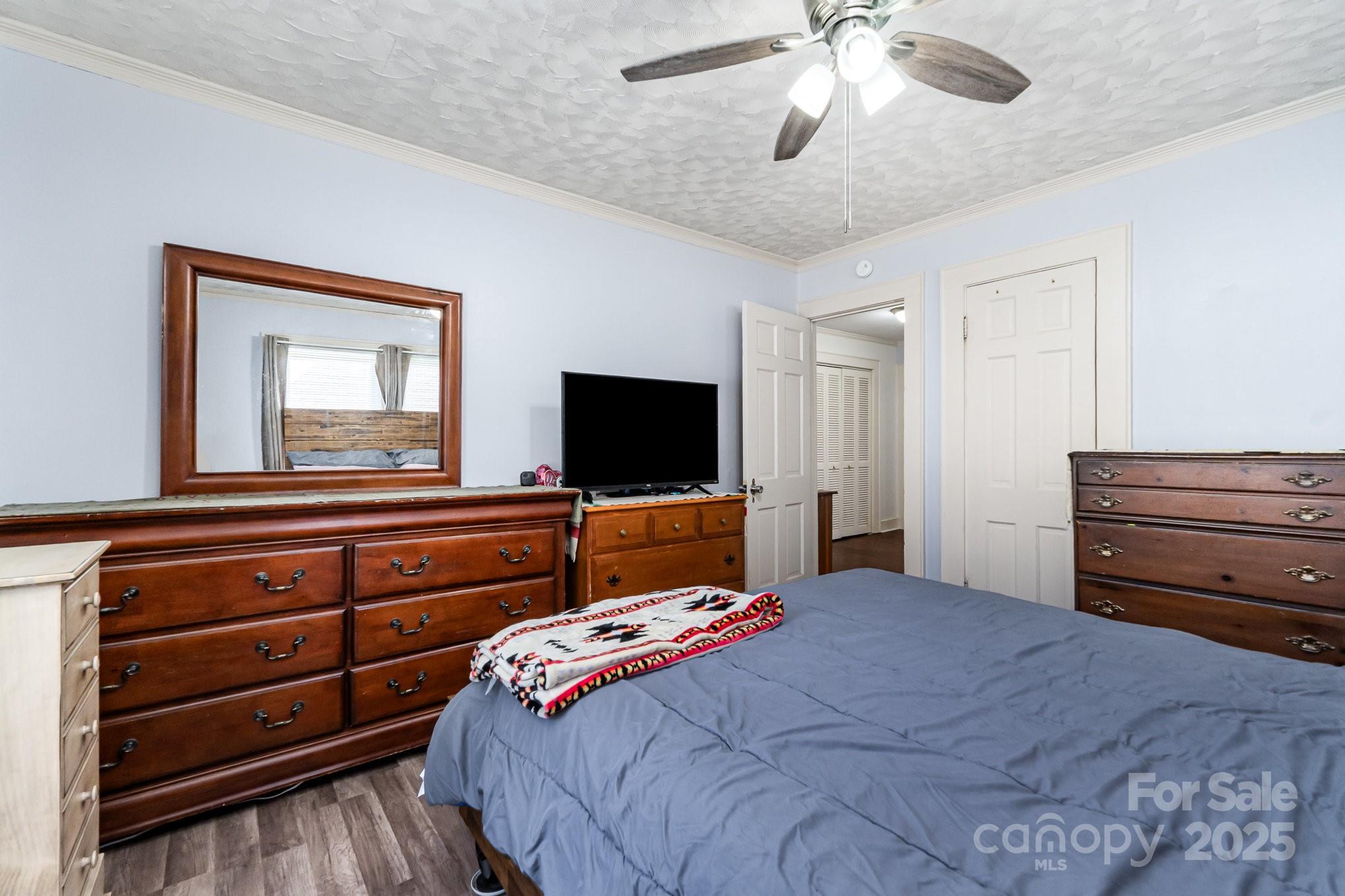 1306 Brantley Road Kannapolis, NC 28083 - Photo 19 of 29 a bedroom with a bed and a television