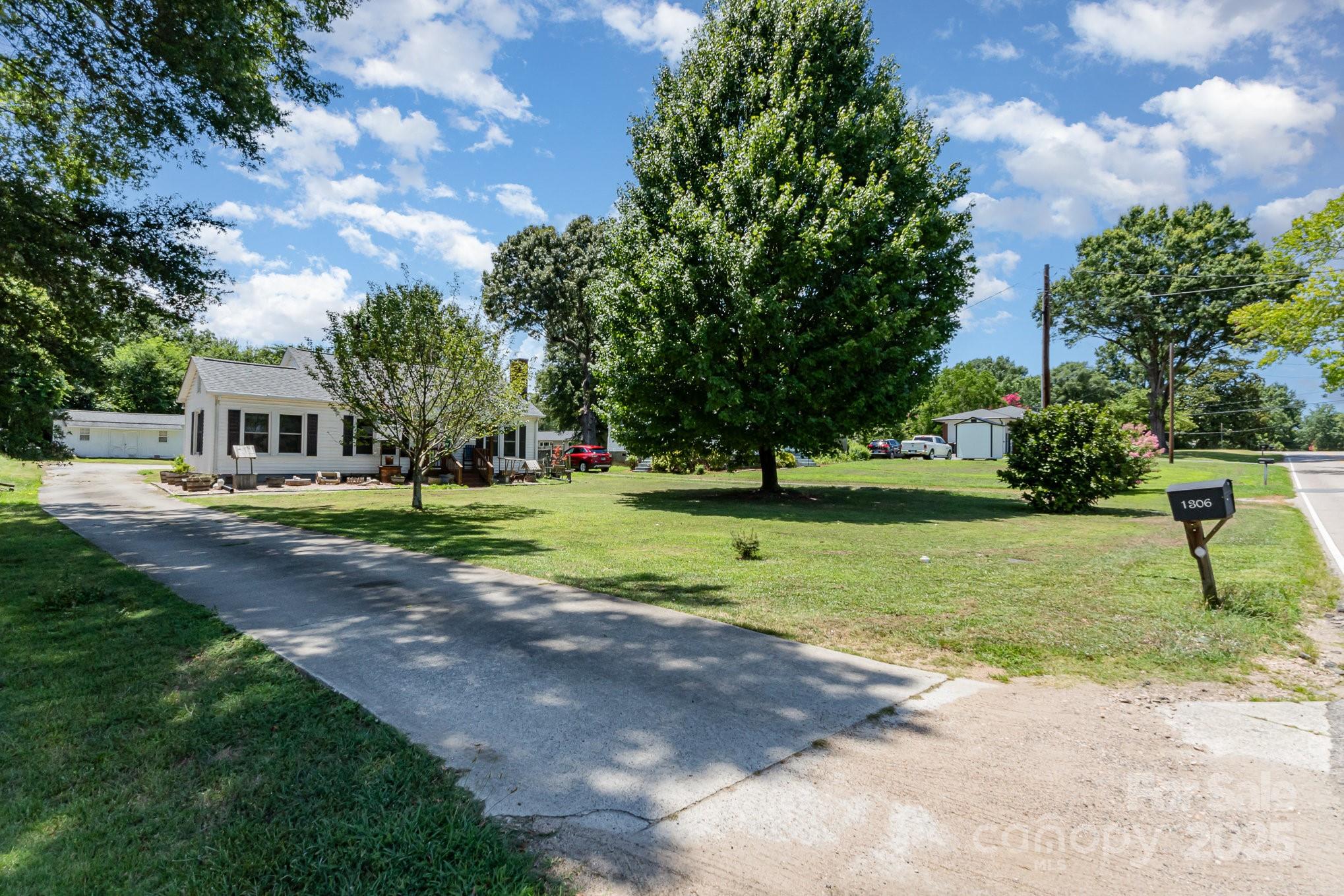 1306 Brantley Road Kannapolis, NC 28083 - Photo 2 of 29 a view of a house with a backyard