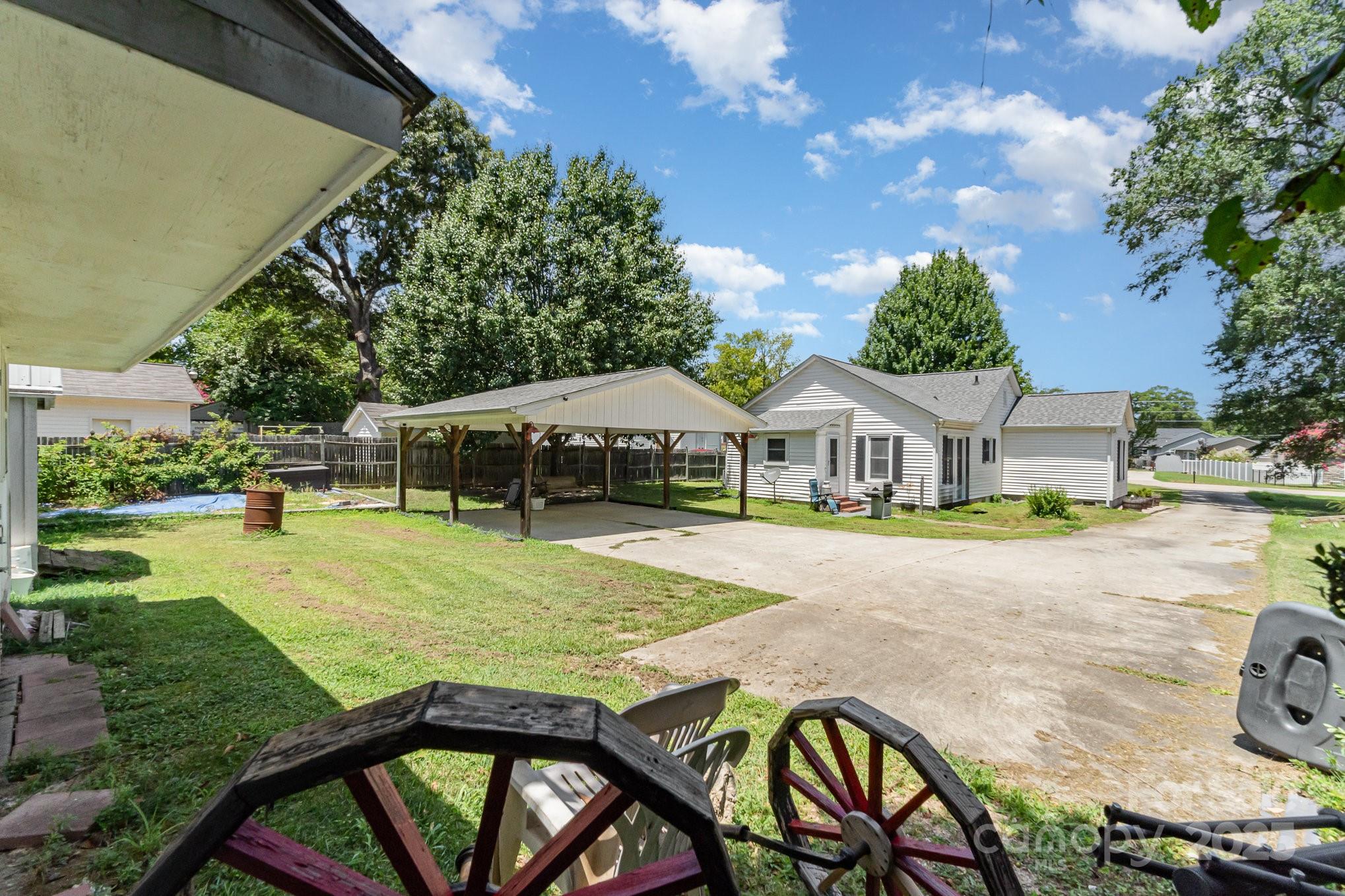 1306 Brantley Road Kannapolis, NC 28083 - Photo 22 of 29 a view of an house with backyard space and swimming pool