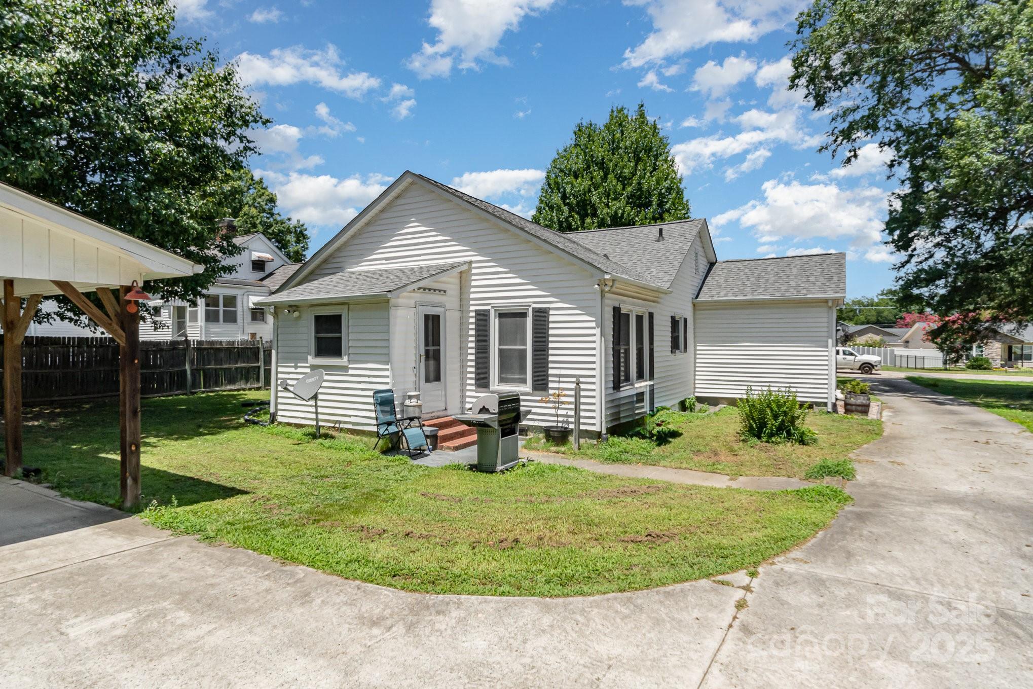 1306 Brantley Road Kannapolis, NC 28083 - Photo 24 of 29 a view of a house with backyard sitting area and garden
