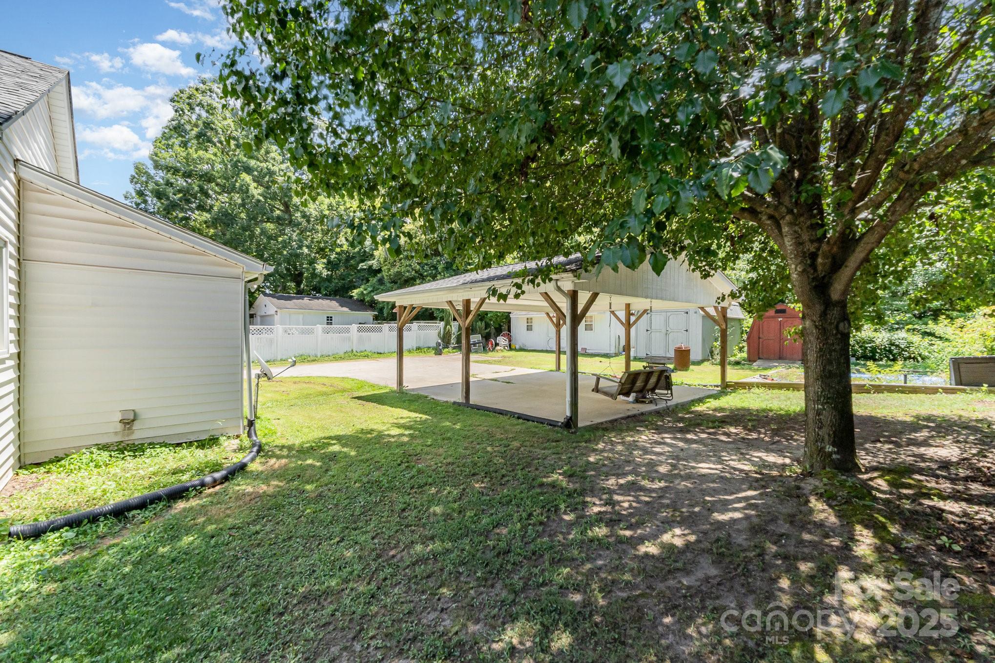 1306 Brantley Road Kannapolis, NC 28083 - Photo 27 of 29 a view of a bench in a garden