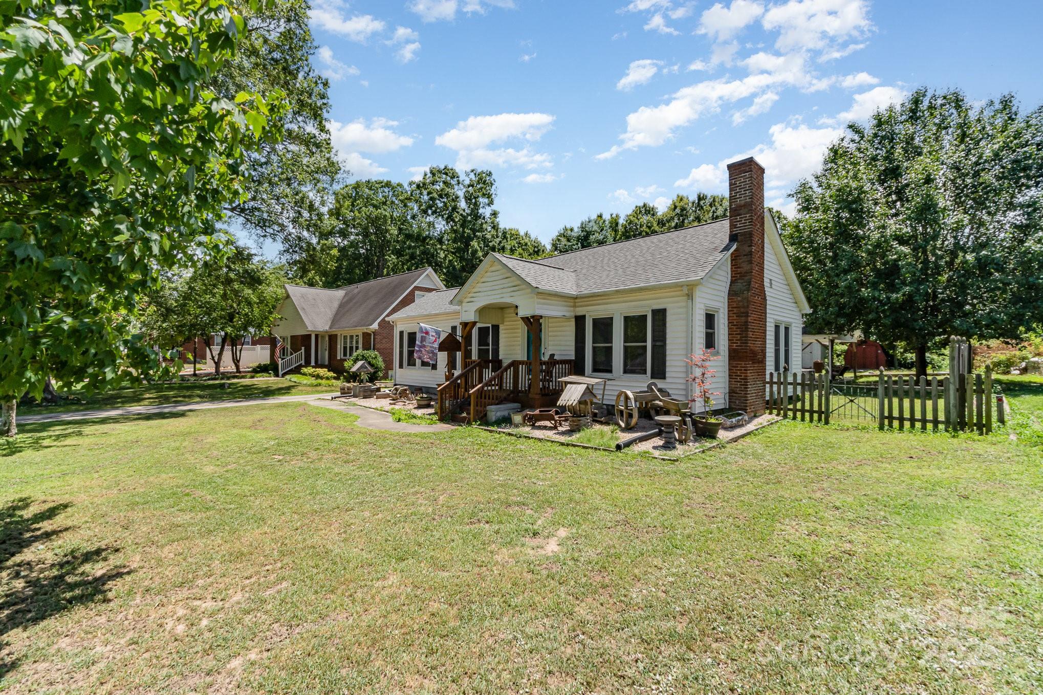 1306 Brantley Road Kannapolis, NC 28083 - Photo 3 of 29 a front view of a house with swimming pool having outdoor seating