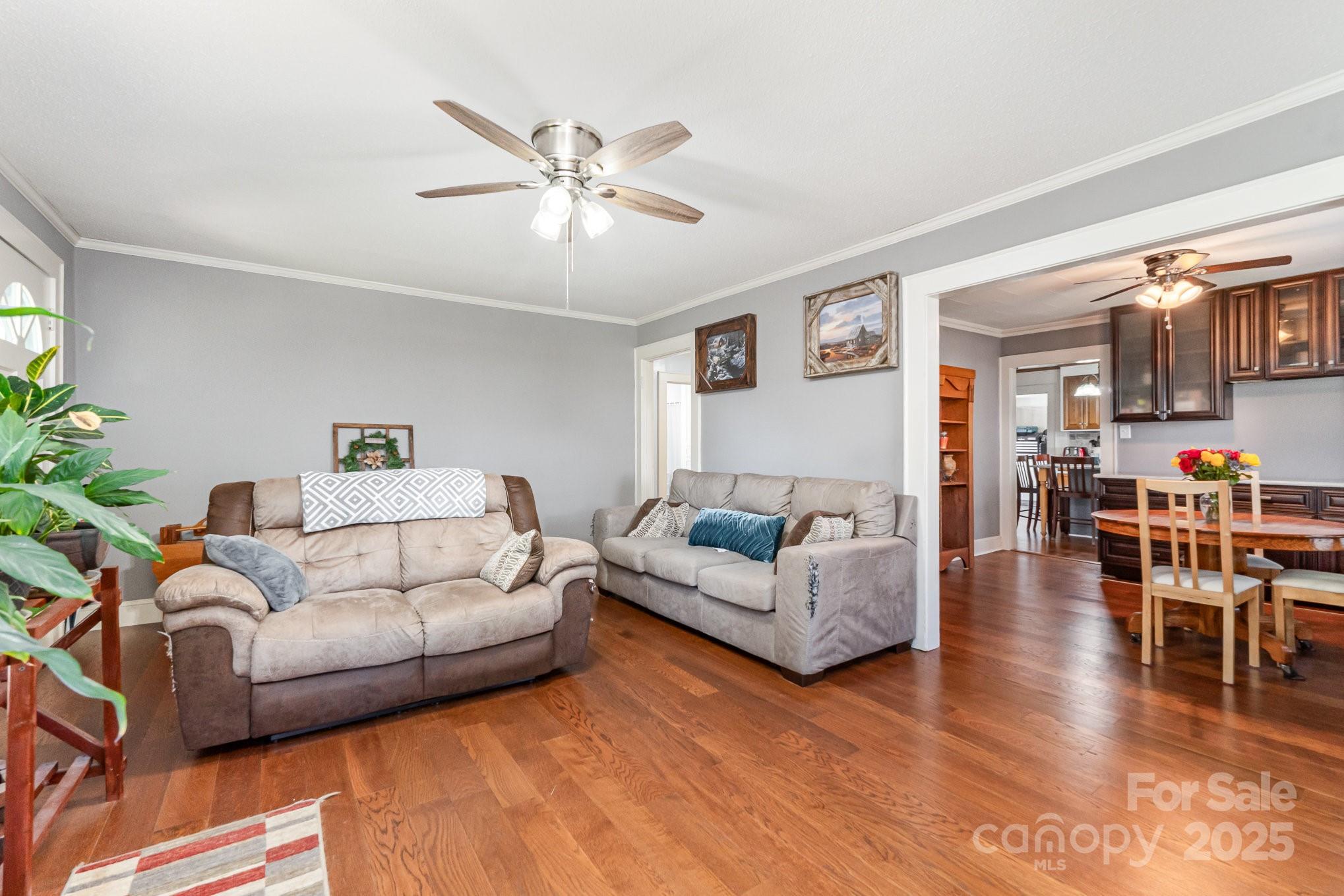 1306 Brantley Road Kannapolis, NC 28083 - Photo 6 of 29 a living room with furniture and a dining table with wooden floor