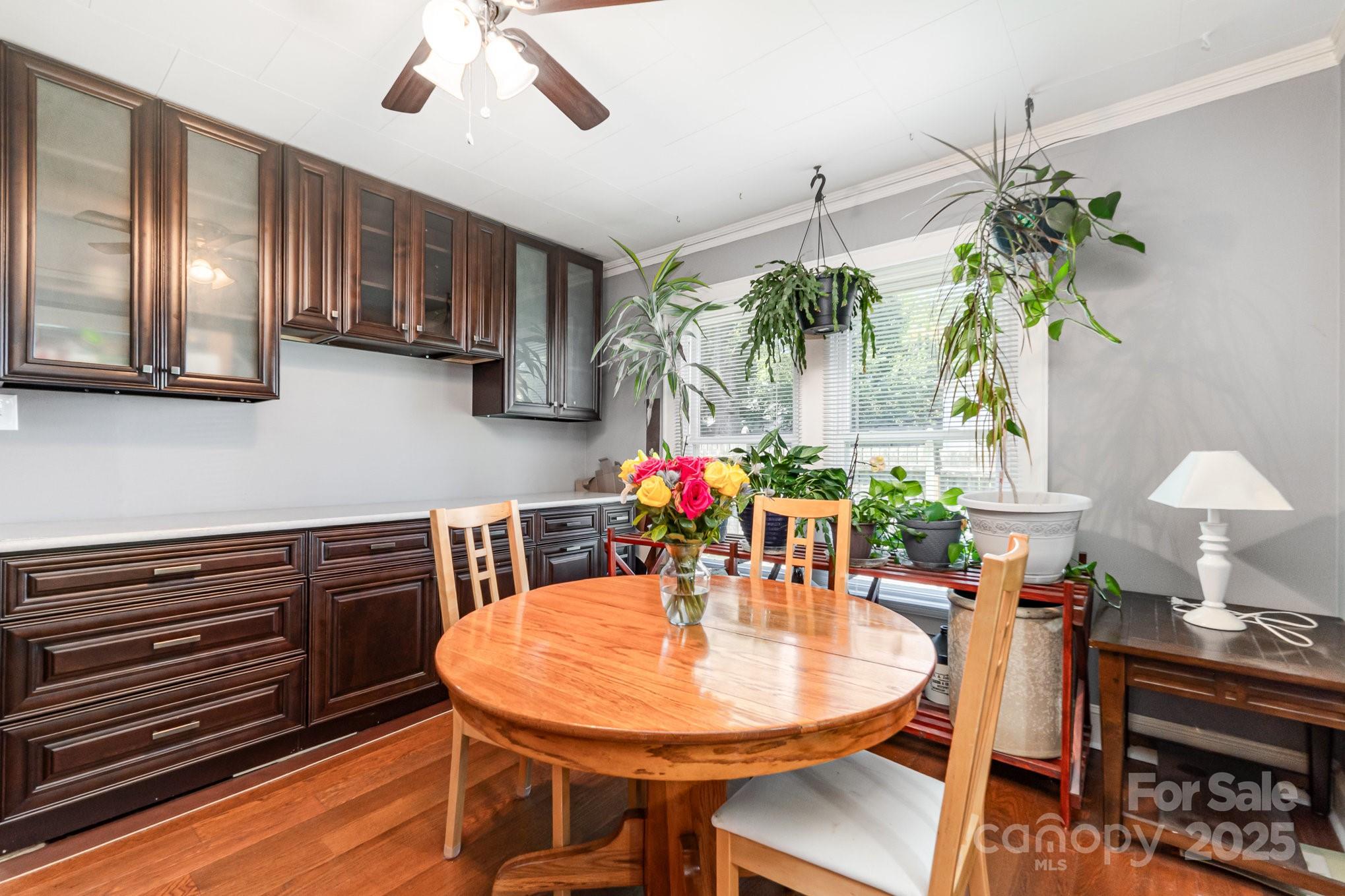 1306 Brantley Road Kannapolis, NC 28083 - Photo 8 of 29 a view of a dining room with furniture and chandelier