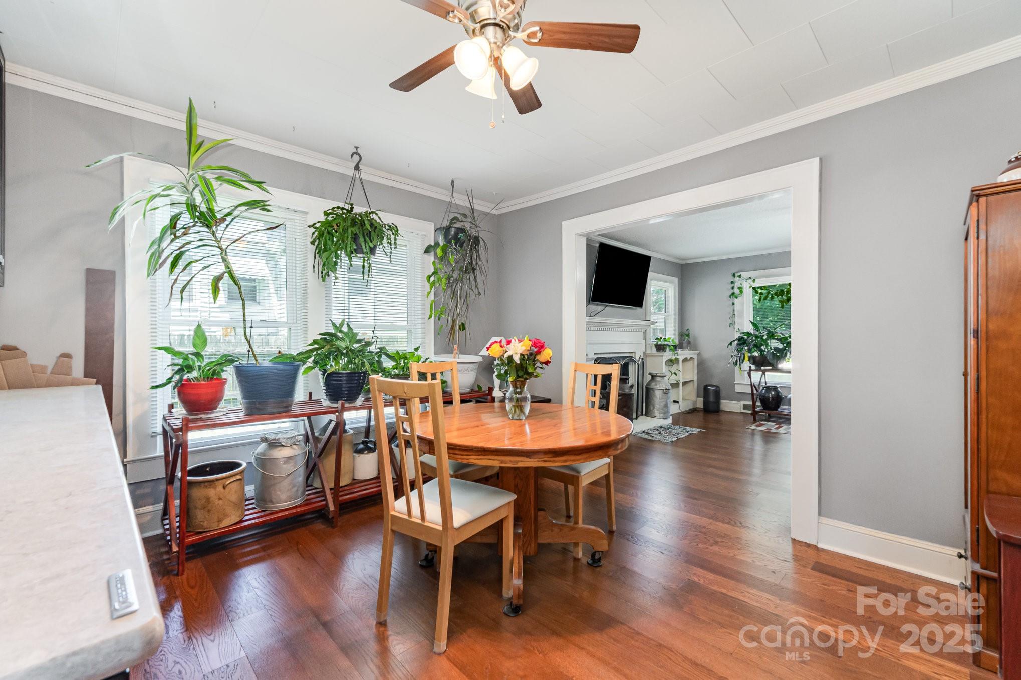 1306 Brantley Road Kannapolis, NC 28083 - Photo 10 of 29 a view of a dining room with furniture and wooden floor