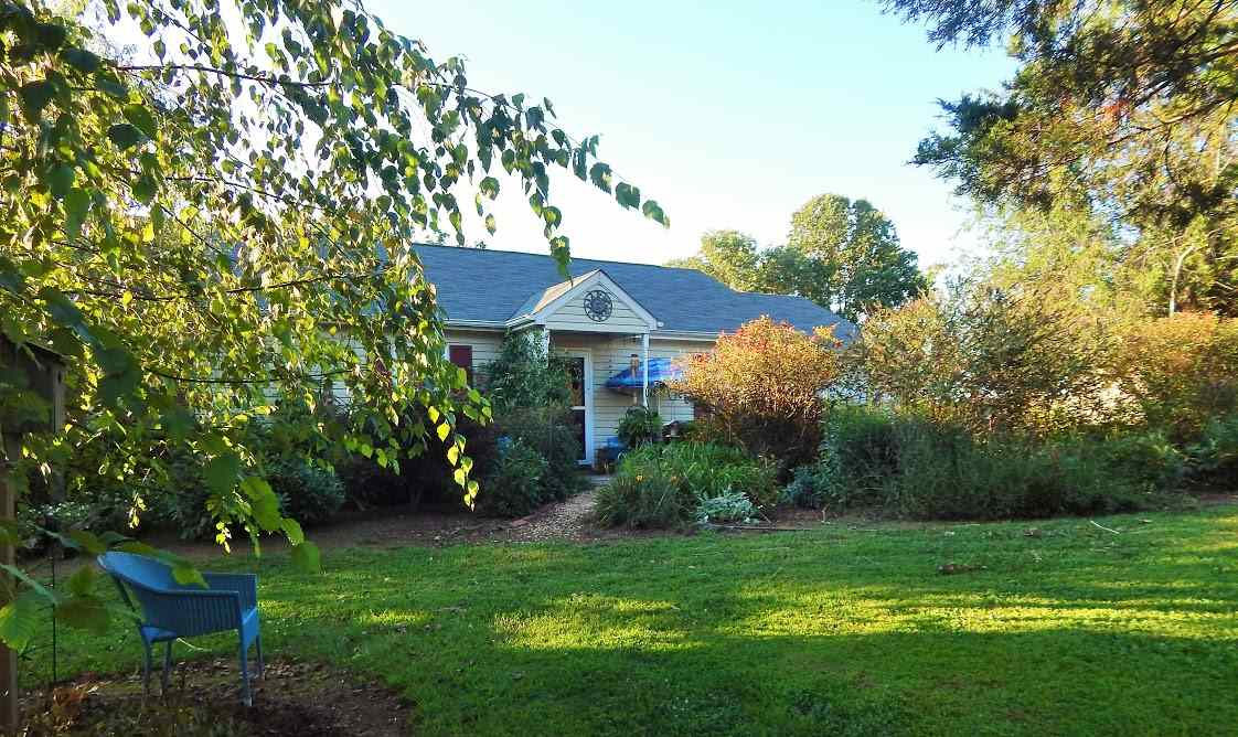 87 East Daffodil Road Ruckersville, VA 22968 - Photo 1 of 8 a view of a house with a yard and sitting area
