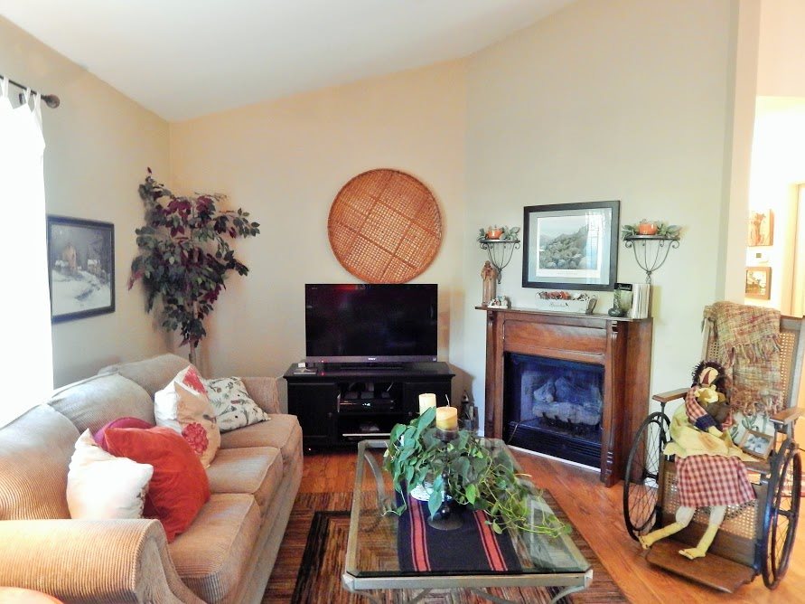 87 East Daffodil Road Ruckersville, VA 22968 - Photo 2 of 8 a living room with furniture a flat screen tv and a fireplace