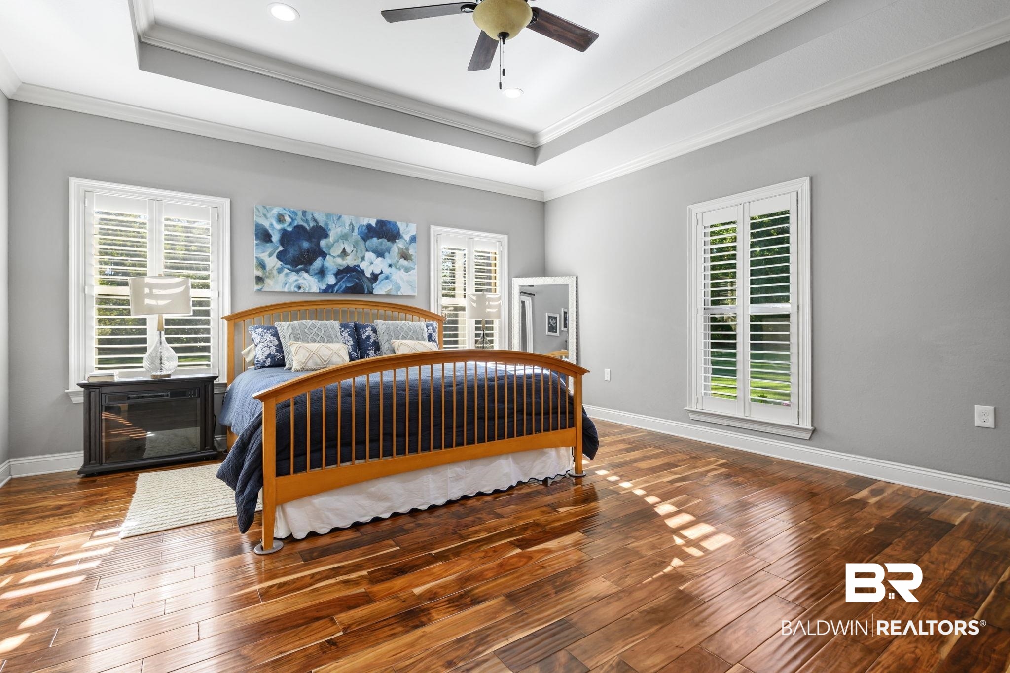 52579 Stockton Cemetery Road Stockton, AL 36507 - Photo 34 of 66 Bedroom with a raised ceiling, crown molding, wood-type flooring, a ceiling fan, and recessed lighting