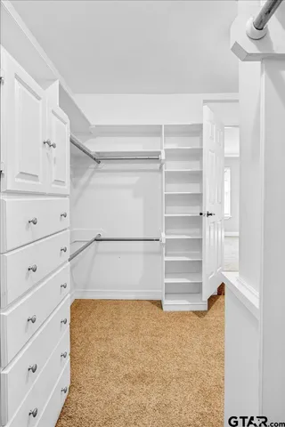a view of an empty walk in closet