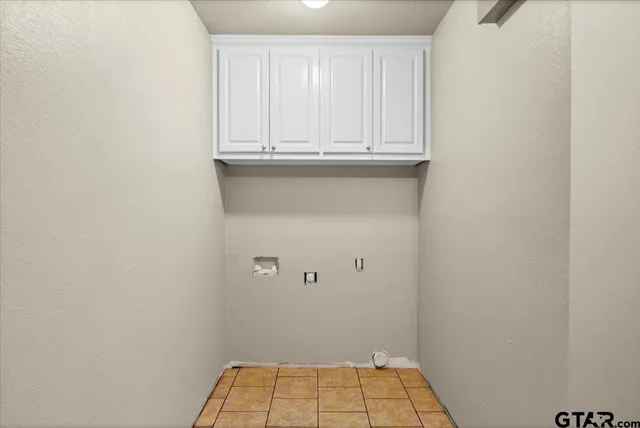 a view of small space with white cabinets