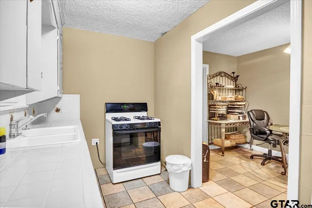 a bathroom with a toilet a sink and a mirror