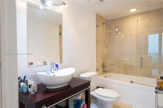 a bathroom with a toilet a sink and a bathtub