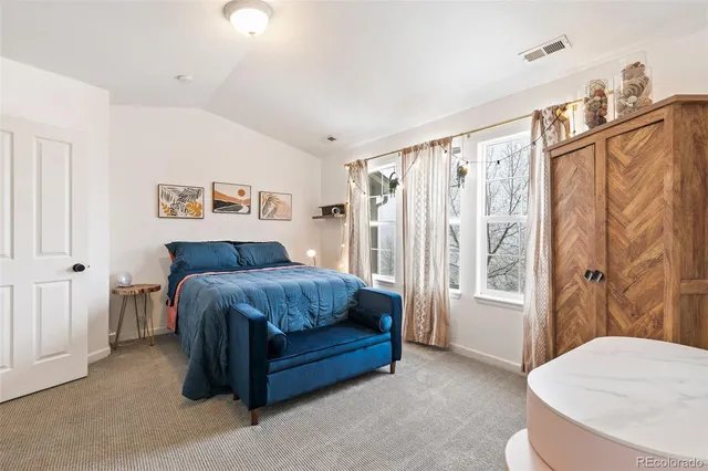 a bed room with a bed and a couch