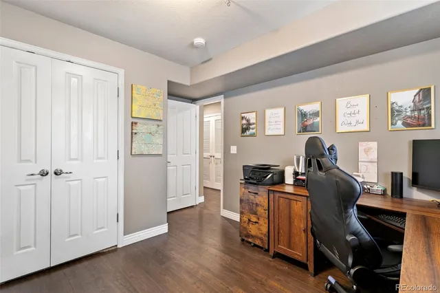 a bathroom with a toilet a sink and a mirror