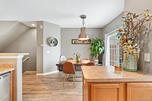 a view of a dining room with furniture and wooden floor