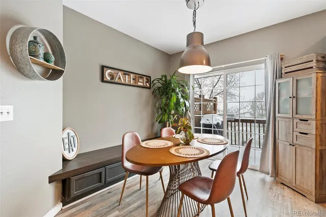 a bedroom that has a bed and a desk in it with window