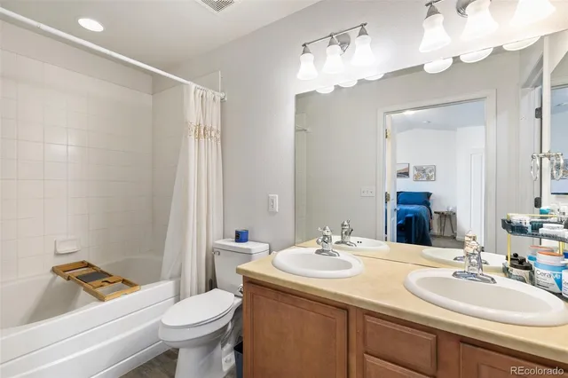 a bedroom with a large bed and a large window