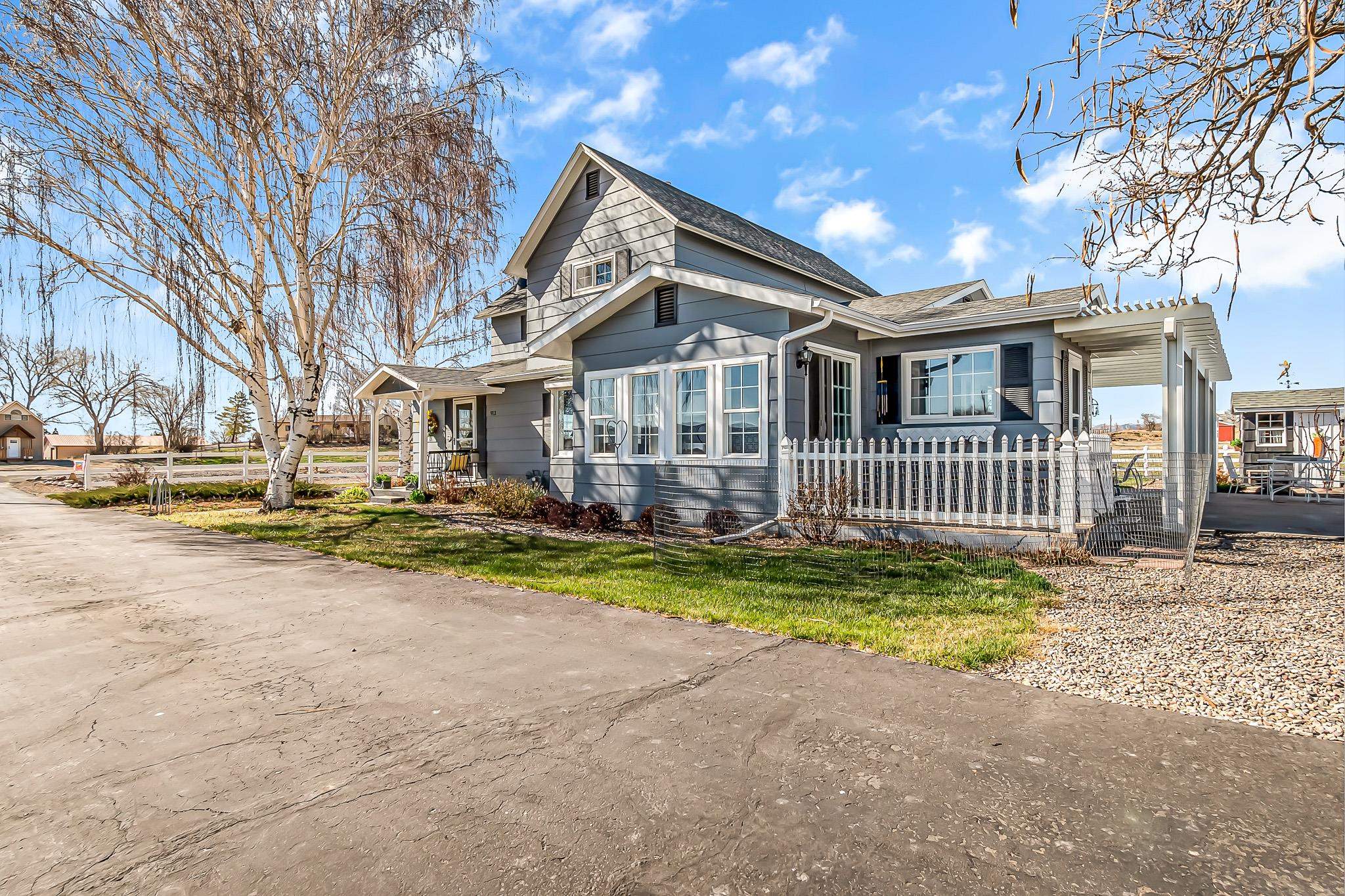 912 24 Road Grand Junction, CO 81505 - Photo 1 of 42 a front view of a house with a yard