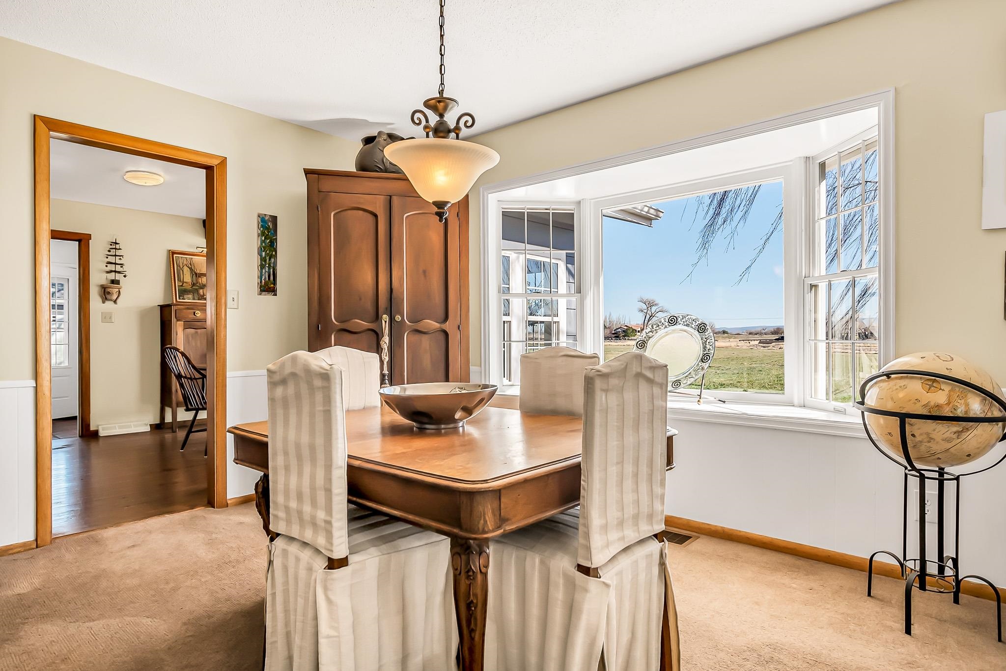 912 24 Road Grand Junction, CO 81505 - Photo 11 of 42 a dining room with furniture and a window