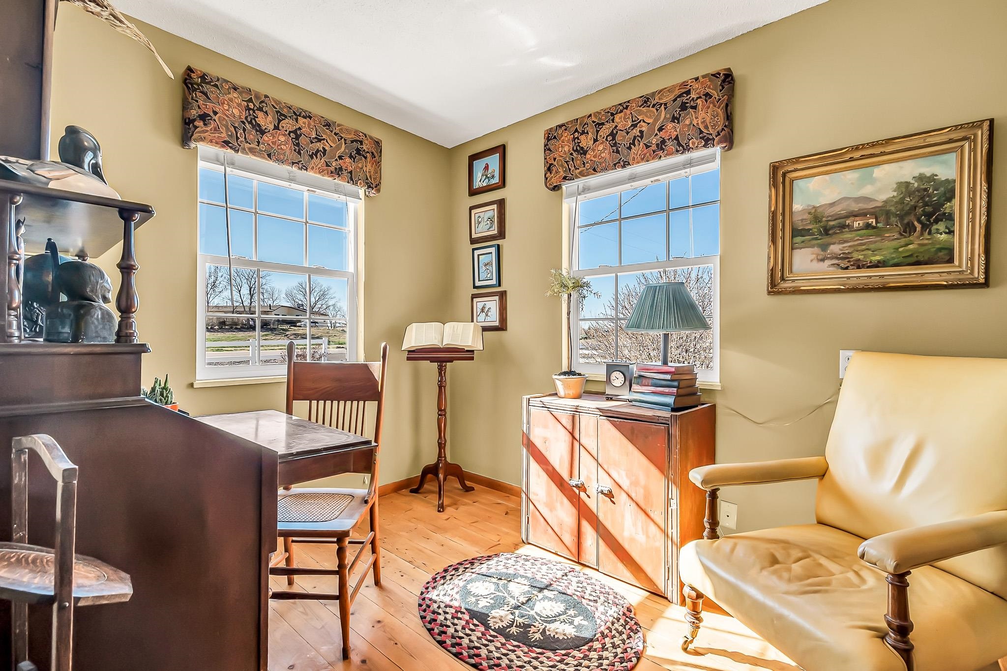 912 24 Road Grand Junction, CO 81505 - Photo 12 of 42 a living room with furniture and a painting on the wall