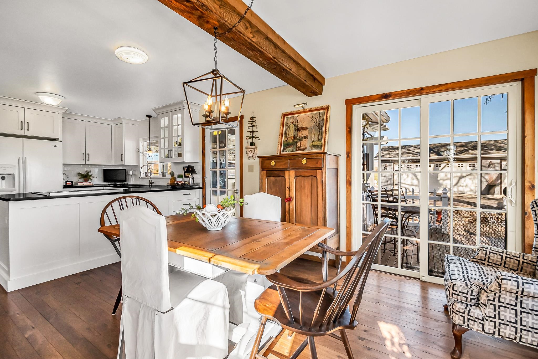 912 24 Road Grand Junction, CO 81505 - Photo 17 of 42 a dining room with furniture and wooden floor