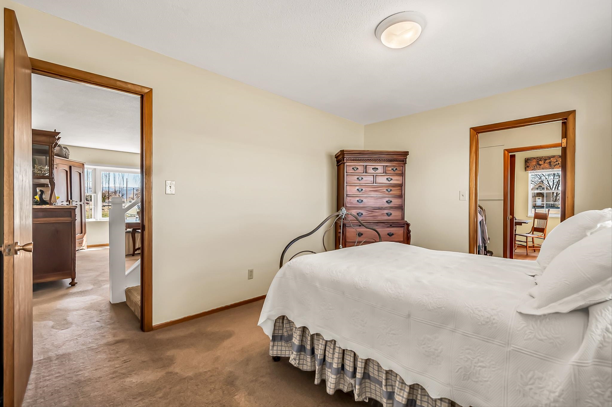 912 24 Road Grand Junction, CO 81505 - Photo 20 of 42 a bedroom with a large bed and a chandelier