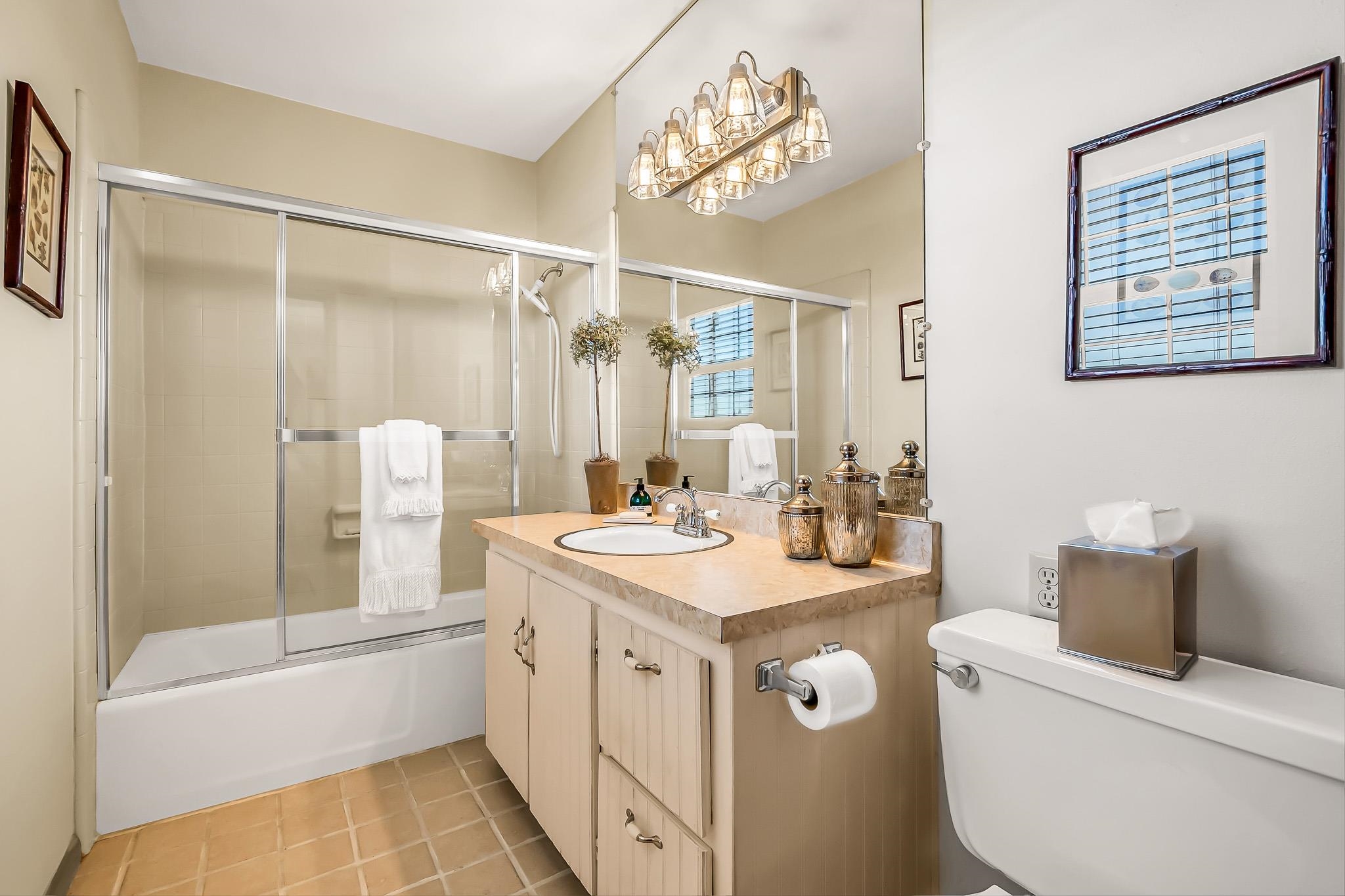 912 24 Road Grand Junction, CO 81505 - Photo 21 of 42 a bathroom with a granite countertop sink a toilet and shower