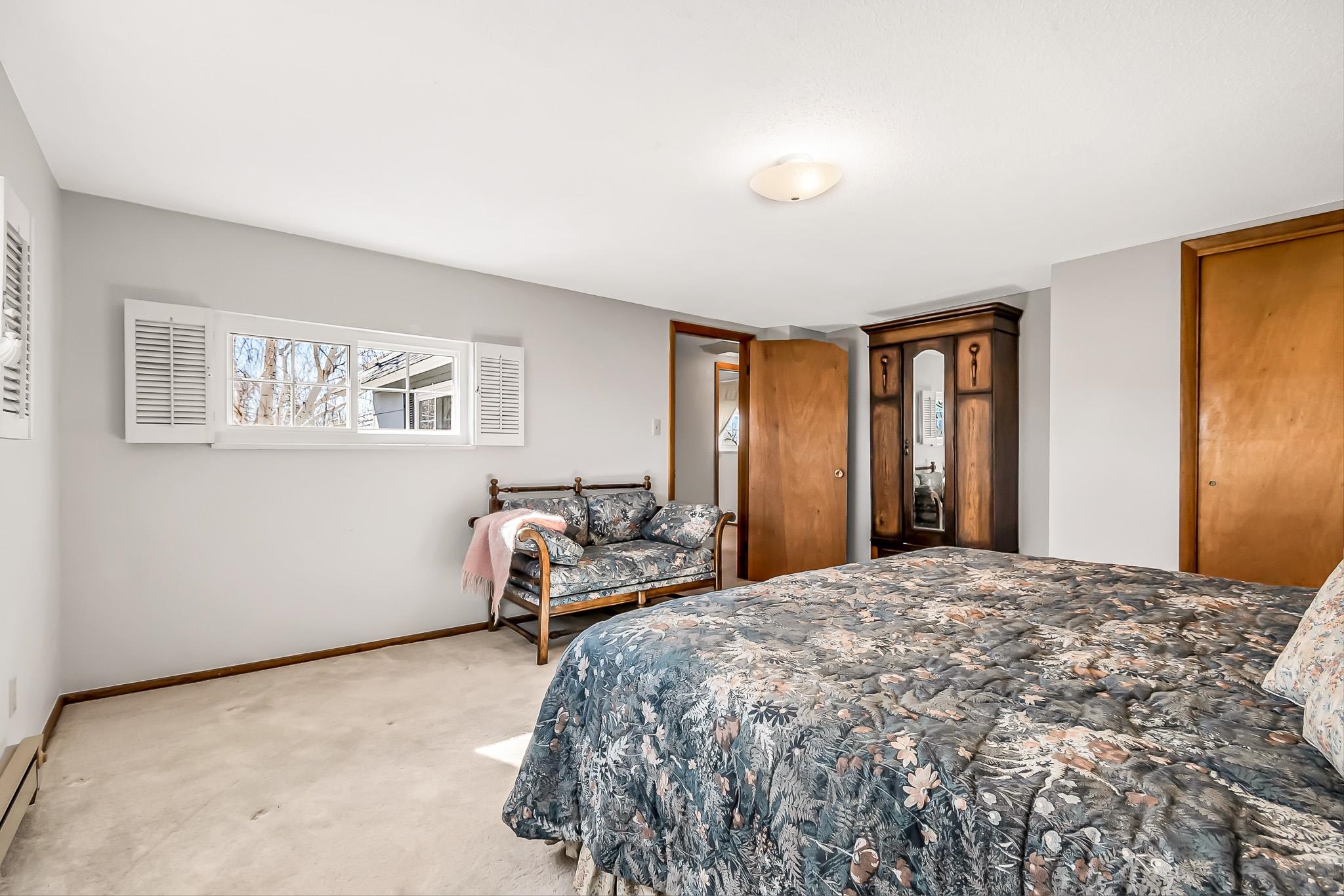 912 24 Road Grand Junction, CO 81505 - Photo 23 of 42 a bedroom with a large bed and a window