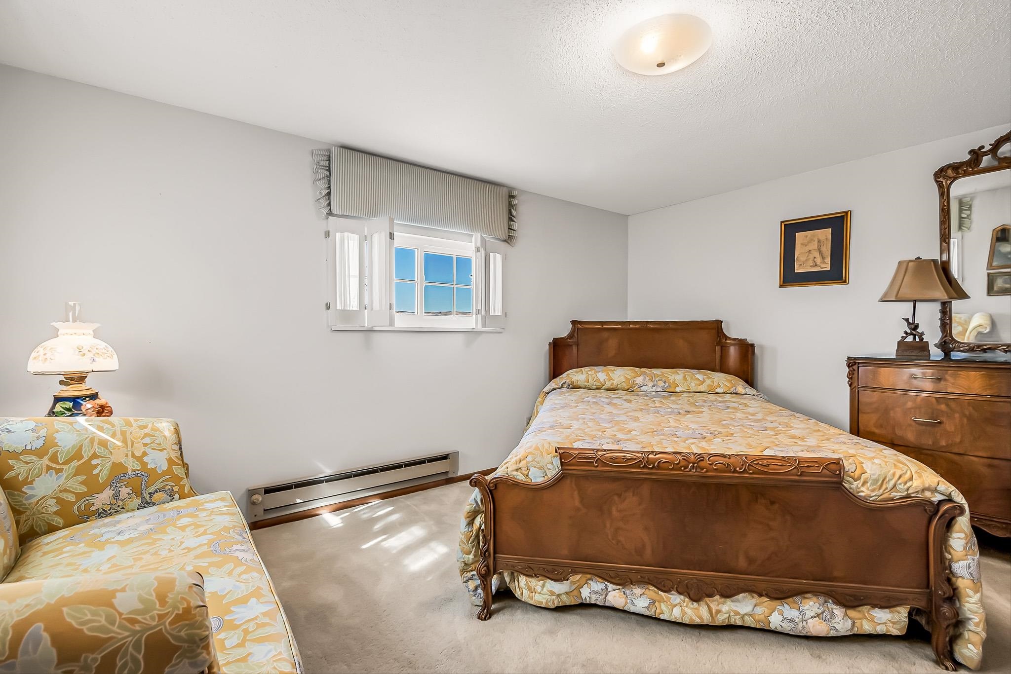 912 24 Road Grand Junction, CO 81505 - Photo 24 of 42 a bedroom with a bed and window