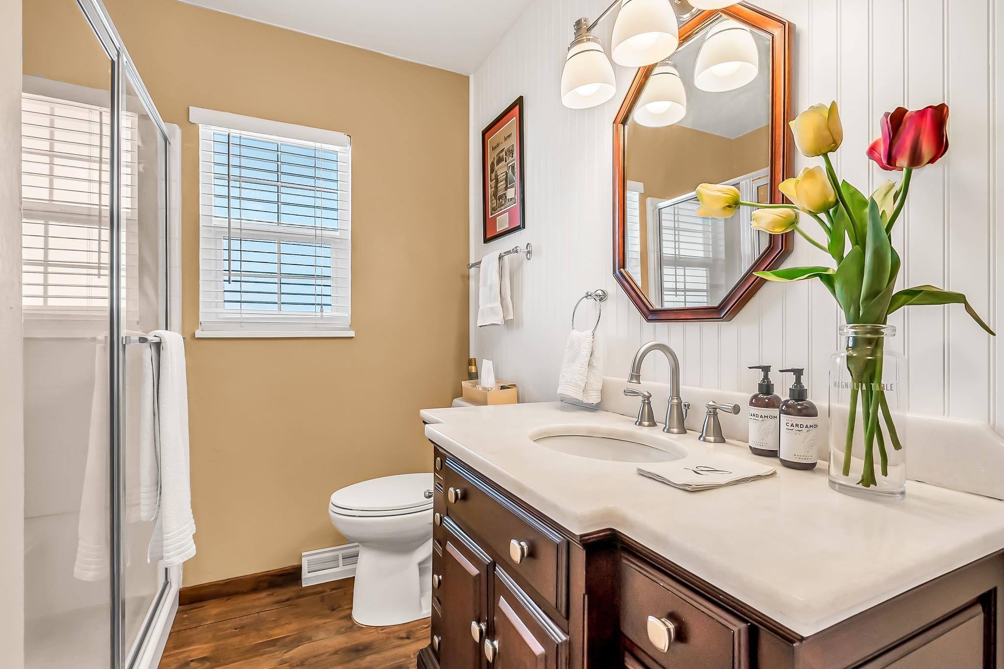 912 24 Road Grand Junction, CO 81505 - Photo 25 of 42 a bathroom with a sink a toilet and a mirror