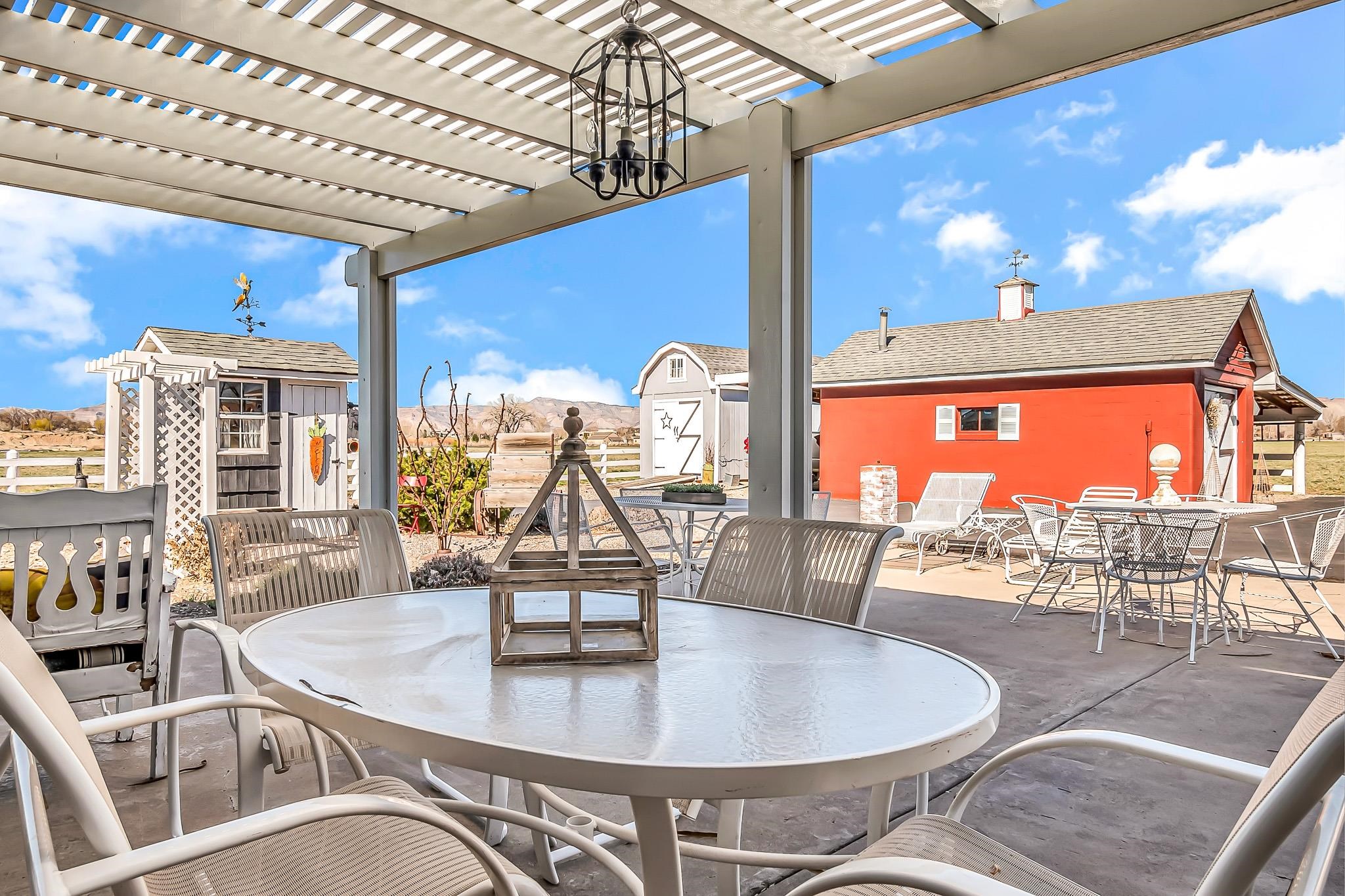 912 24 Road Grand Junction, CO 81505 - Photo 29 of 42 a dining room with furniture a chandelier and wooden floor