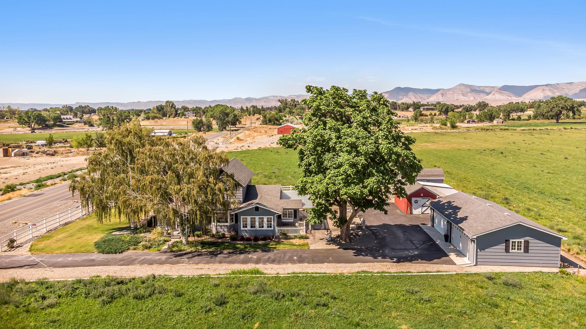 912 24 Road Grand Junction, CO 81505 - Photo 33 of 42 an aerial view of a house with a garden and lake view