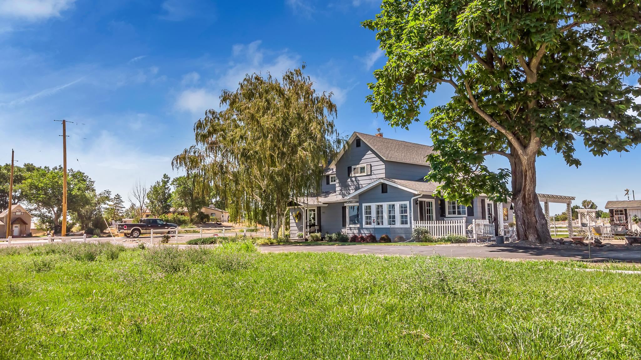 912 24 Road Grand Junction, CO 81505 - Photo 34 of 42 a house view with swimming pool and wooden fence
