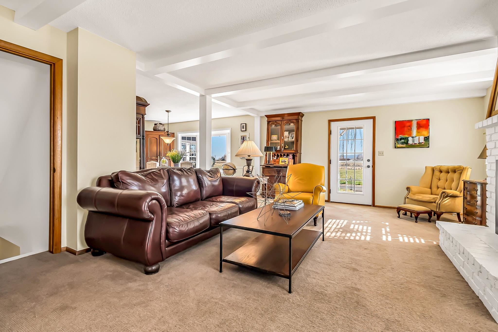 912 24 Road Grand Junction, CO 81505 - Photo 8 of 42 a living room with furniture and a couch