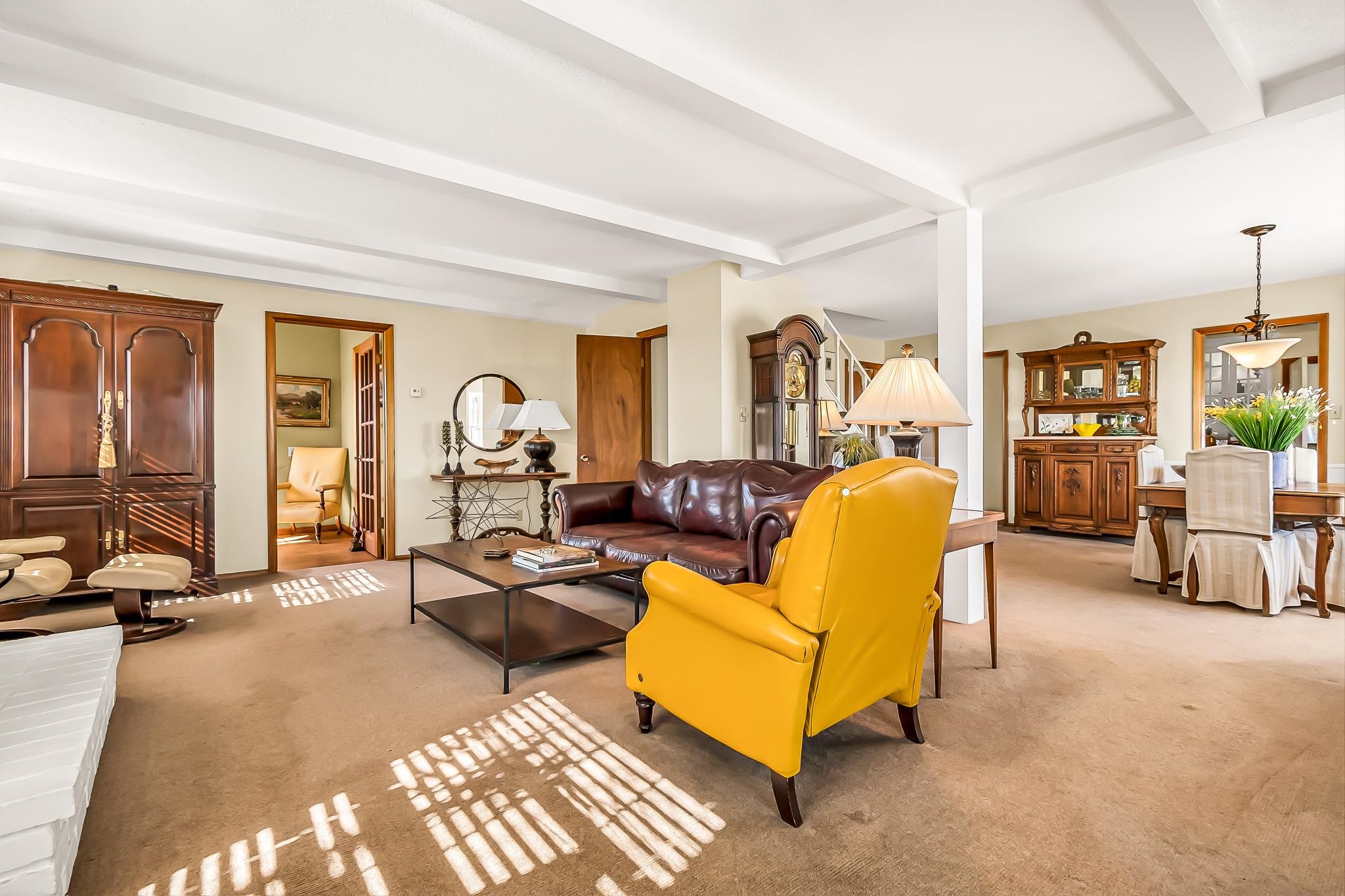 912 24 Road Grand Junction, CO 81505 - Photo 9 of 42 a living room with furniture gym equipment and a large window