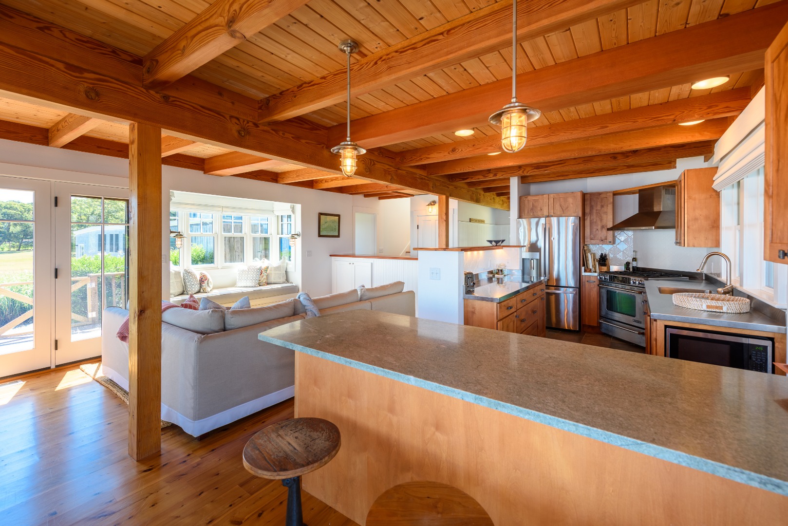 25 The Boulevard Edgartown, MA 02539 - Photo 12 of 40 a view of a kitchen with furniture and a large window