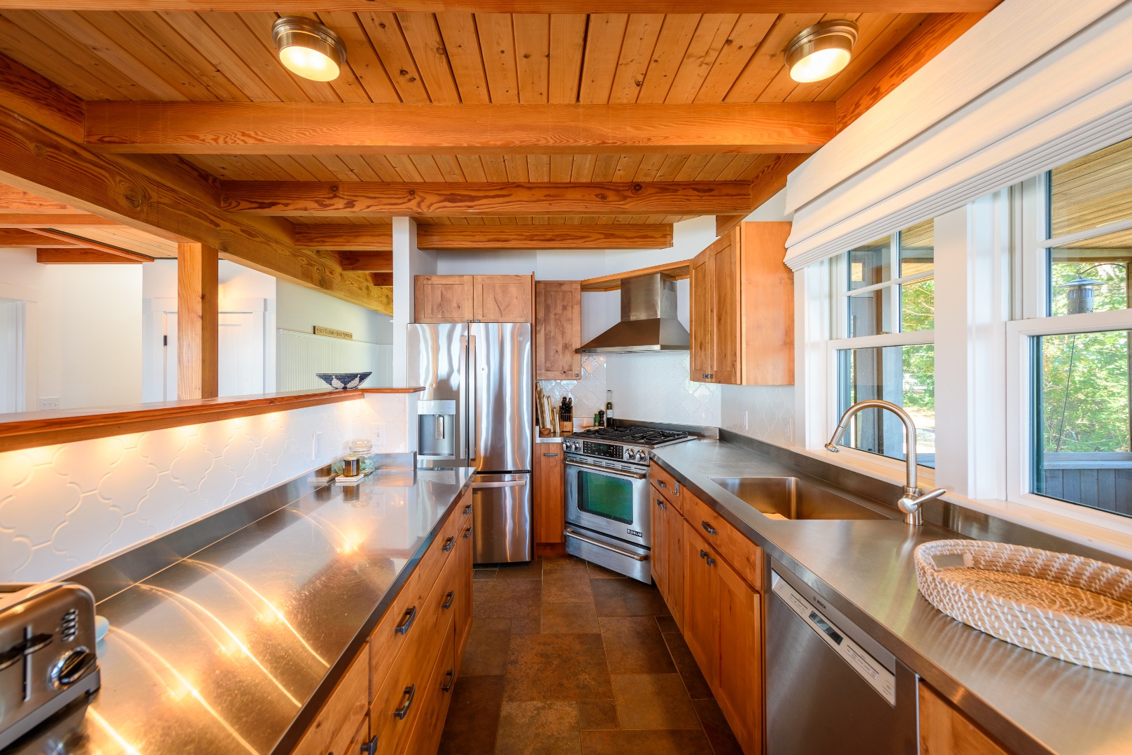 25 The Boulevard Edgartown, MA 02539 - Photo 13 of 40 a kitchen with stainless steel appliances granite countertop a sink and a stove