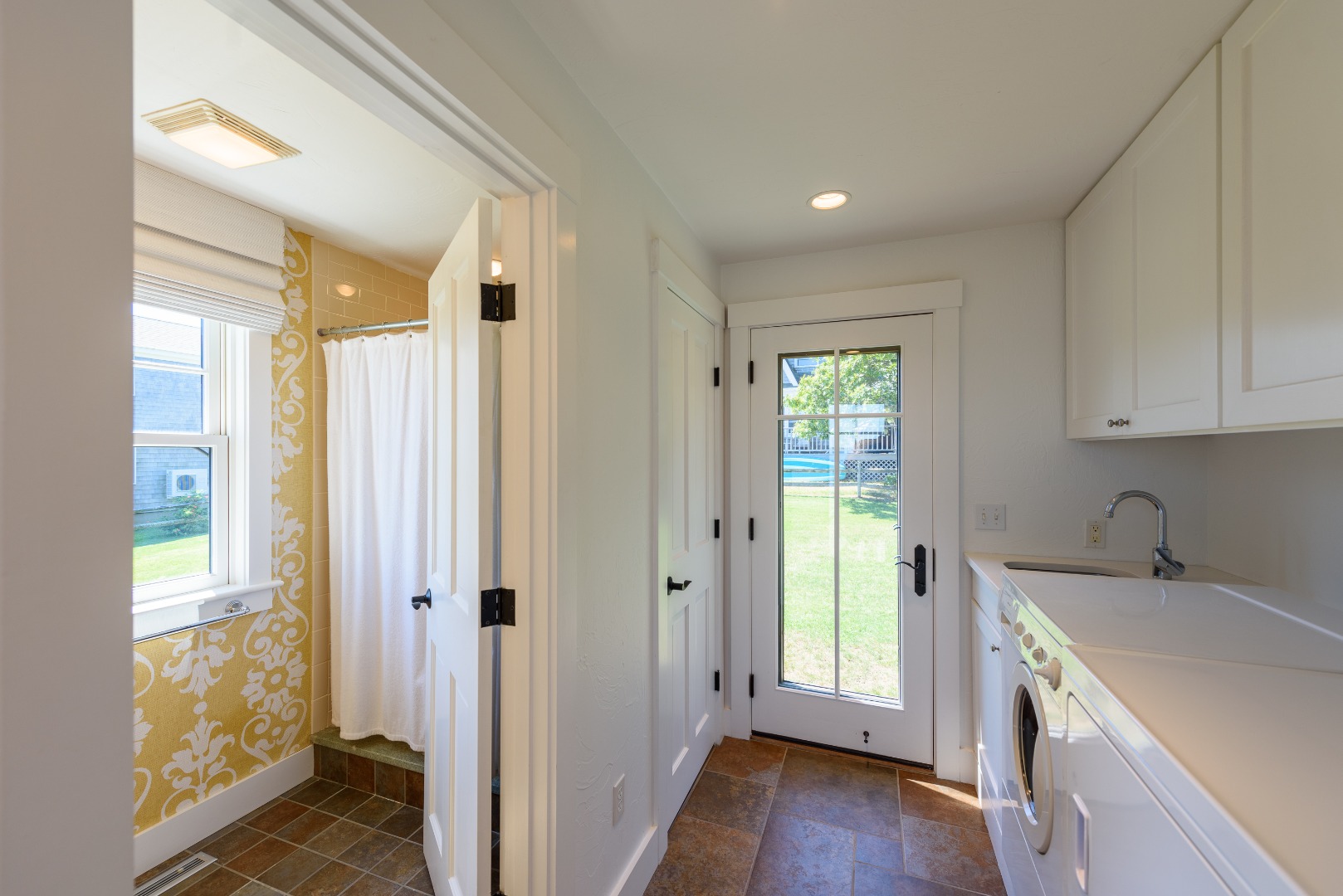 25 The Boulevard Edgartown, MA 02539 - Photo 17 of 40 a view of a kitchen with a sink and a window