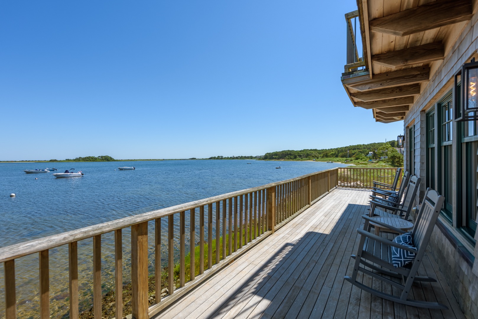 25 The Boulevard Edgartown, MA 02539 - Photo 19 of 40 a view of balcony with wooden floor and outdoor seating