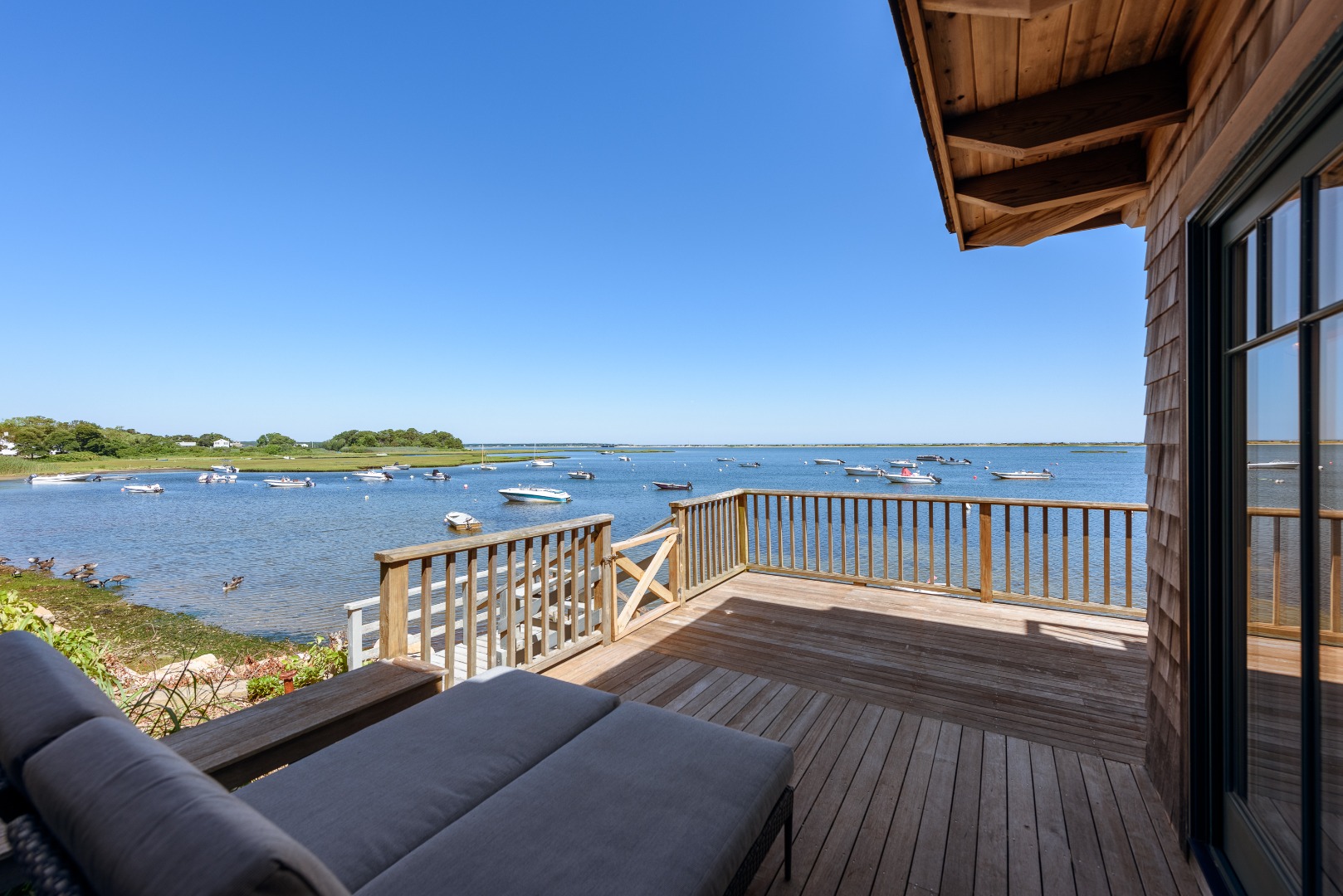25 The Boulevard Edgartown, MA 02539 - Photo 20 of 40 a balcony with furniture and city view