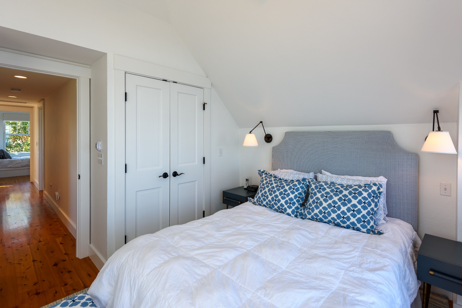 25 The Boulevard Edgartown, MA 02539 - Photo 28 of 40 a bedroom with a bed and wooden floor