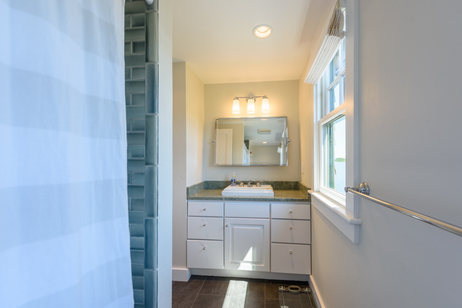 25 The Boulevard Edgartown, MA 02539 - Photo 29 of 40 a bathroom with a sink a mirror and a shower