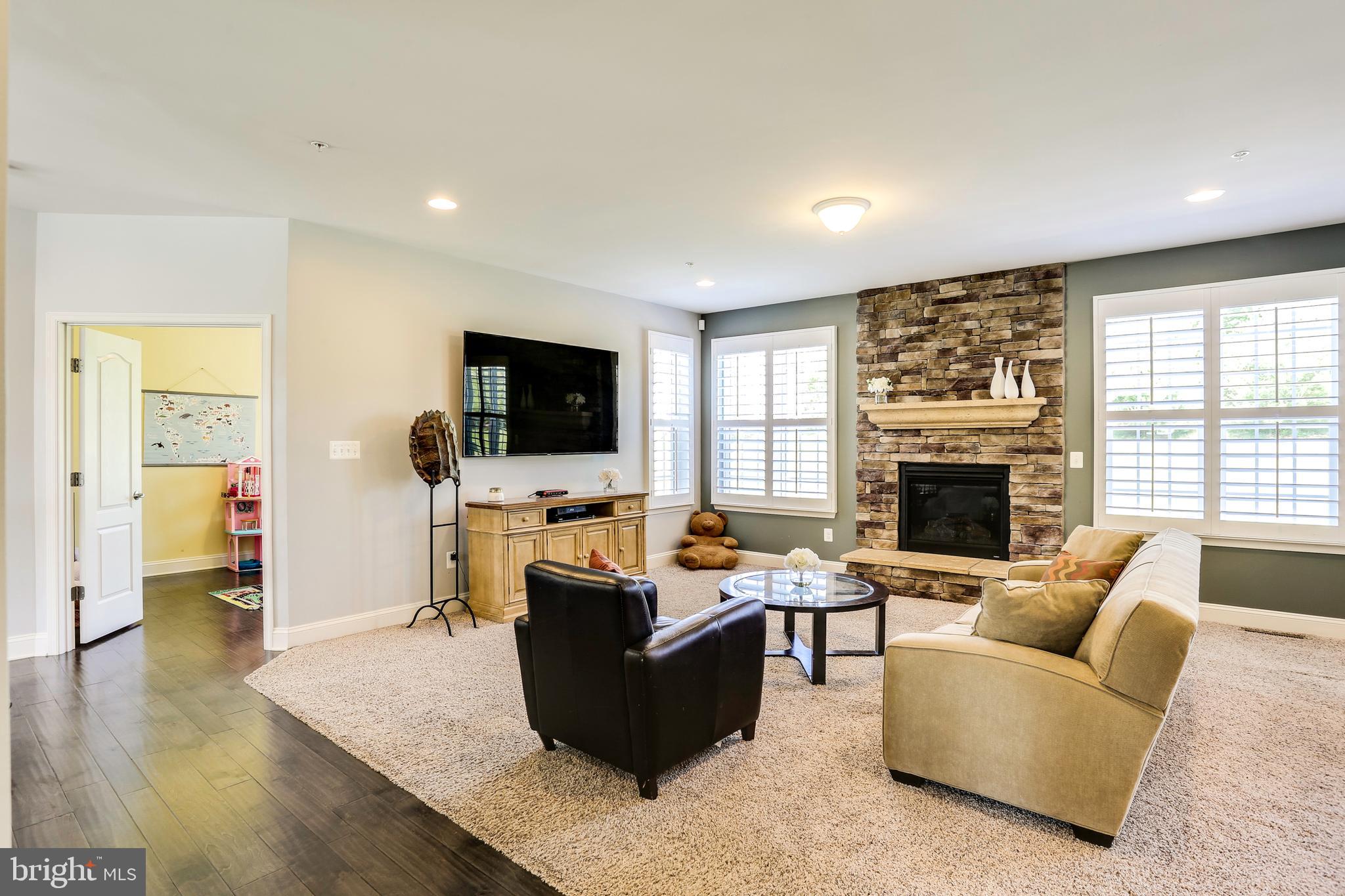 6721 Evanston Road Baltimore, MD 21209 - Photo 11 of 38 Large Family Room w/ Stone Surround Gas Fireplace